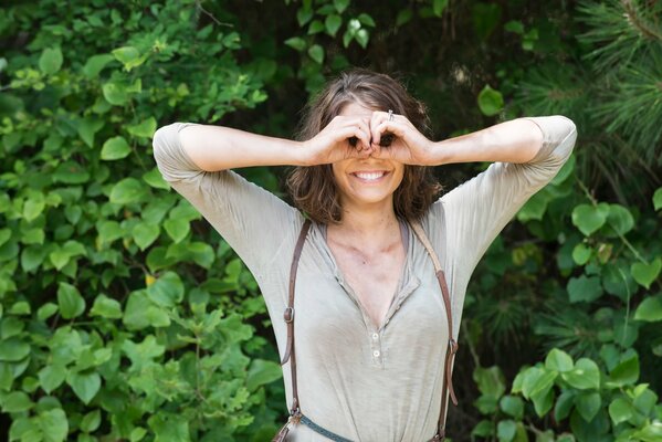 Actress on the background of green plants