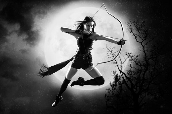 A girl with a loaded bow on the background of the moon