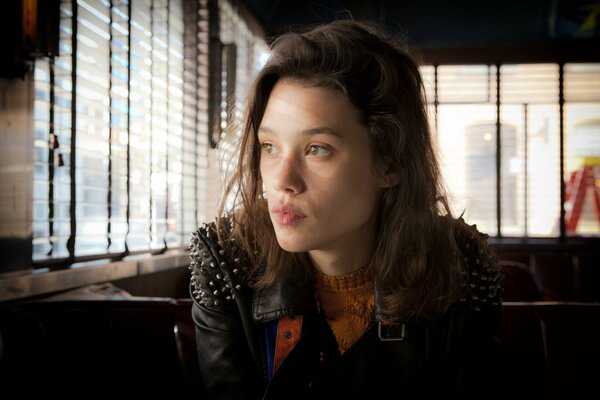 A thoughtful girl in a cafe. Loneliness