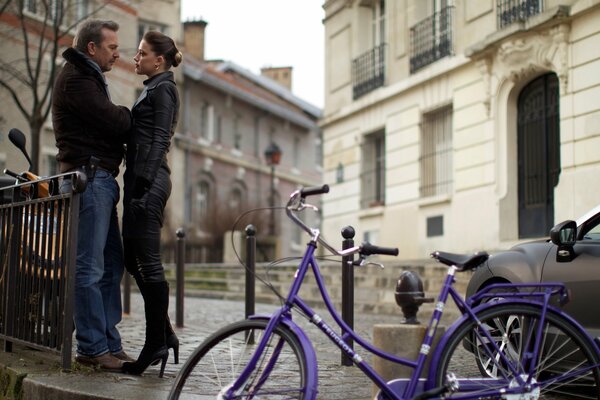 A man and a woman are talking in the square