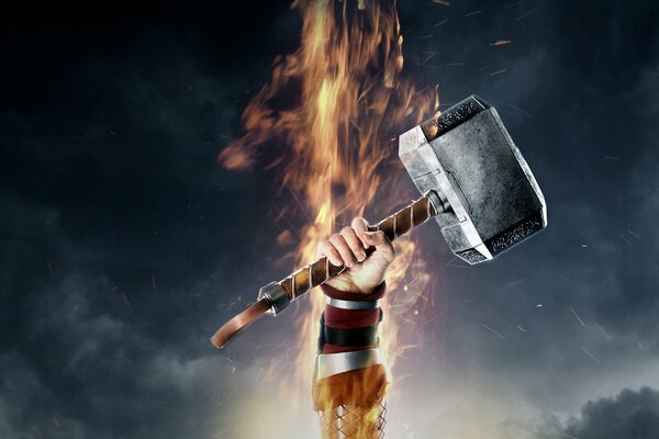 Thor s hammer on the background of fire. Fantasy