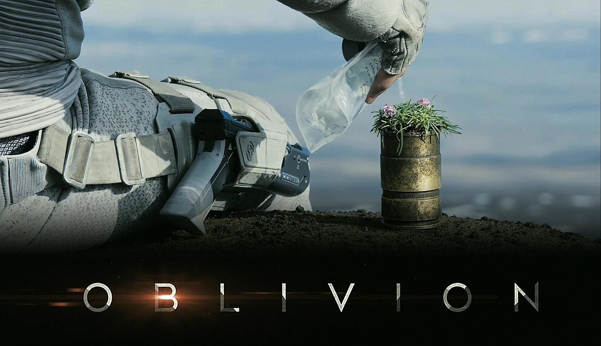 oblio tom cruise oblivion seduto terra fiori acqua