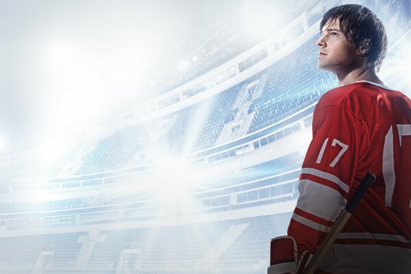 Danila Kozlovsky looks up at the stadium in hockey uniform