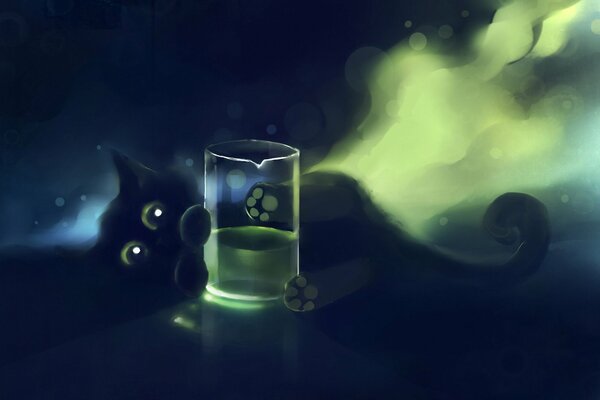 Chaton mignon tenant un verre