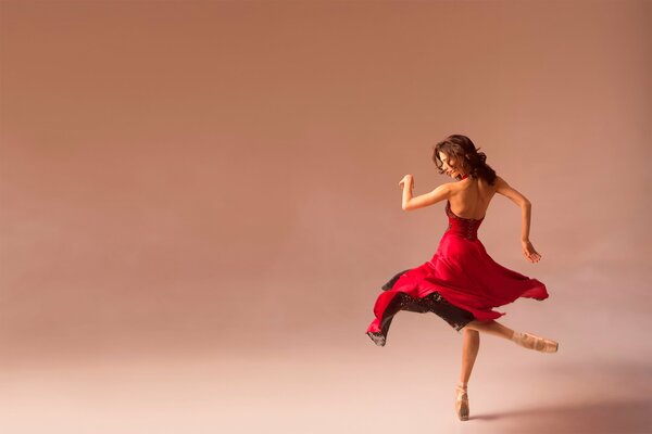 Dance of a ballerina in a red pointe dress