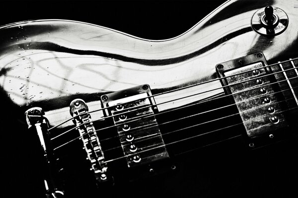 Part of the guitar body close-up in black and white image