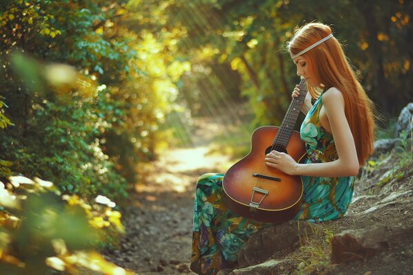 Red-haired girl with a guitar