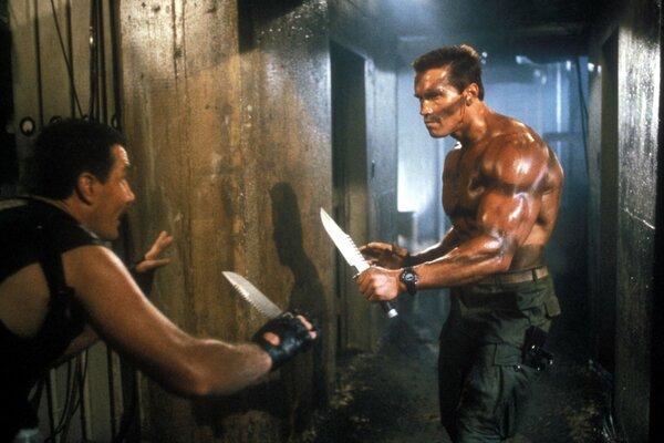 Arnold in a knife fight in the movie Commando