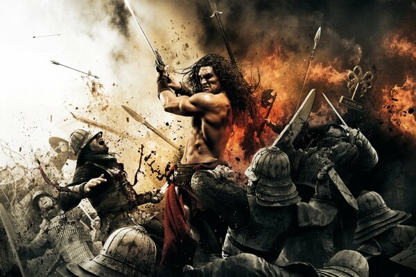 Conan the Barbarian single-handedly destroys an army of armored enemies in battle