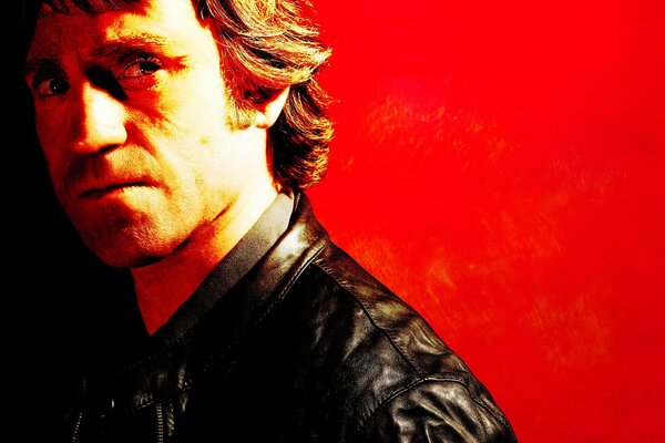 Portrait of Vysotsky on a bright red background