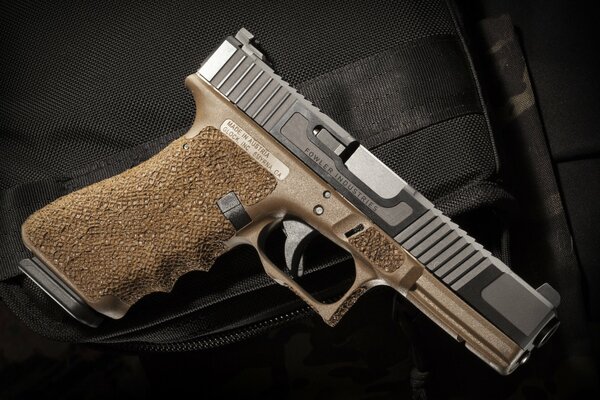 Stylish self-loading pistol in brown shades