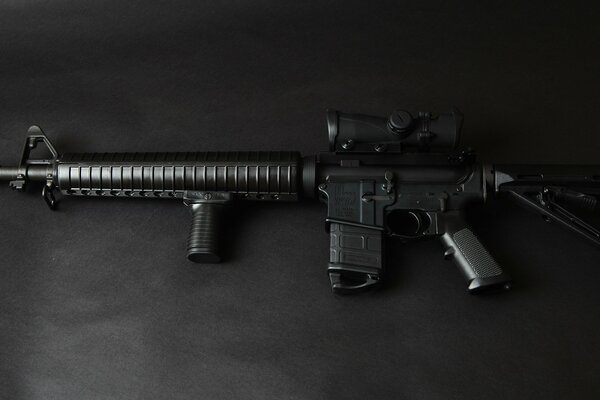 Assault rifle on a black background