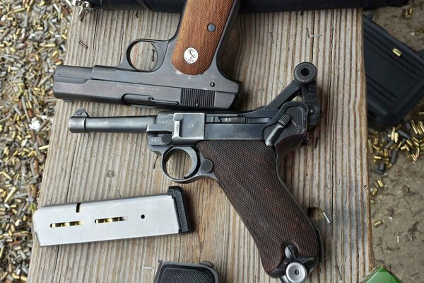 Luger P08 and Colt M1908. Pistols