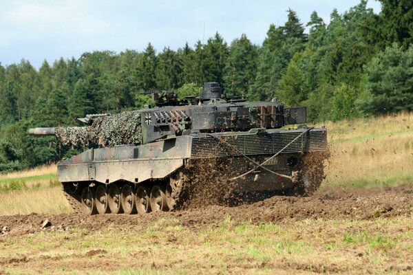 The tank transports weapons across the field