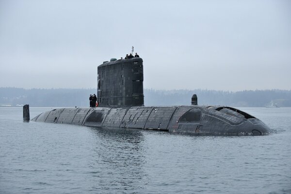 The submarine plunges into the sea near the shore