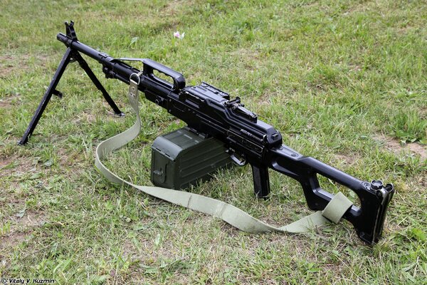 The pkp river machine gun is lying on the grass