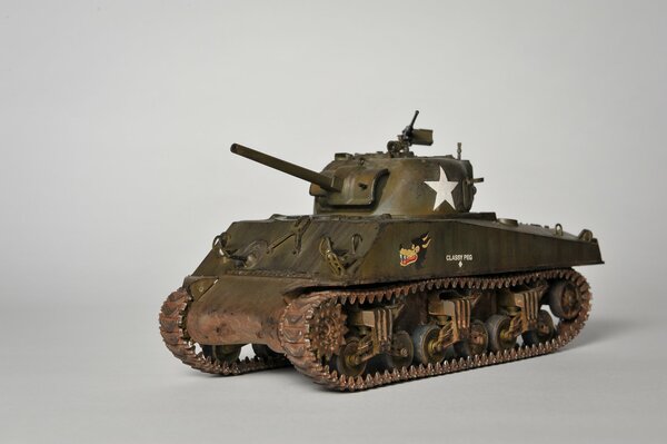 Toy model of the M4 medium tank Sherman . A green toy tank. 