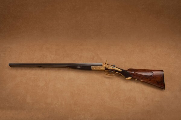 Wooden weapon on beige background