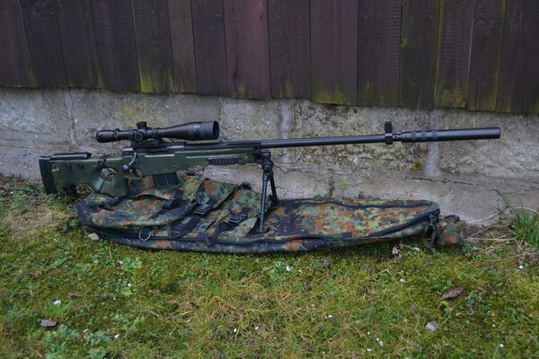 Sniper rifle in a case on the lawn