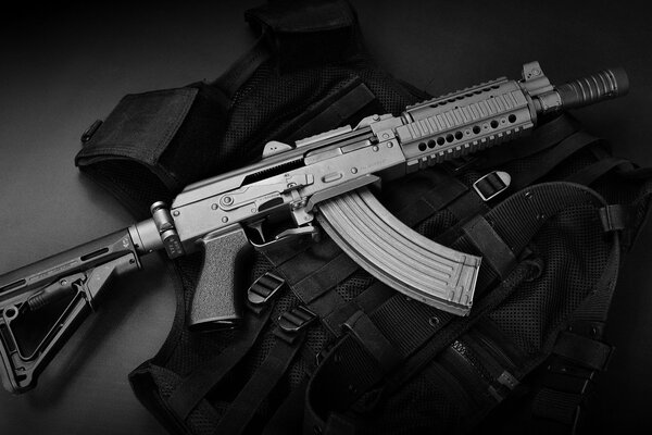 The sbr ak submachine gun is on a bulletproof vest