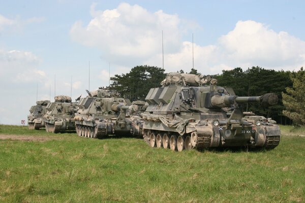 Tanks sky grass clouds