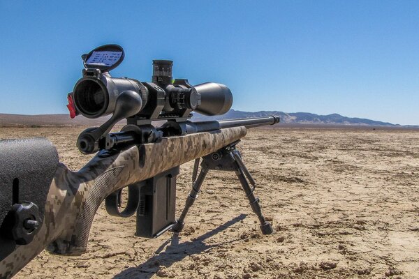 A Savage rifle on a tripod in the steppe