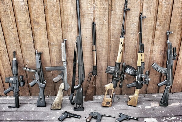 A collection of weapons consisting of pistols, submachine guns and rifles