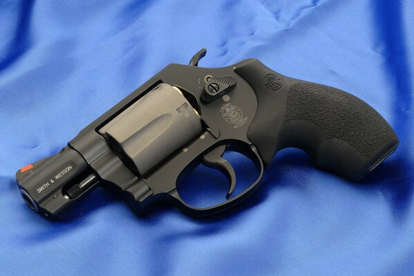 Smith & revolver on a blue background