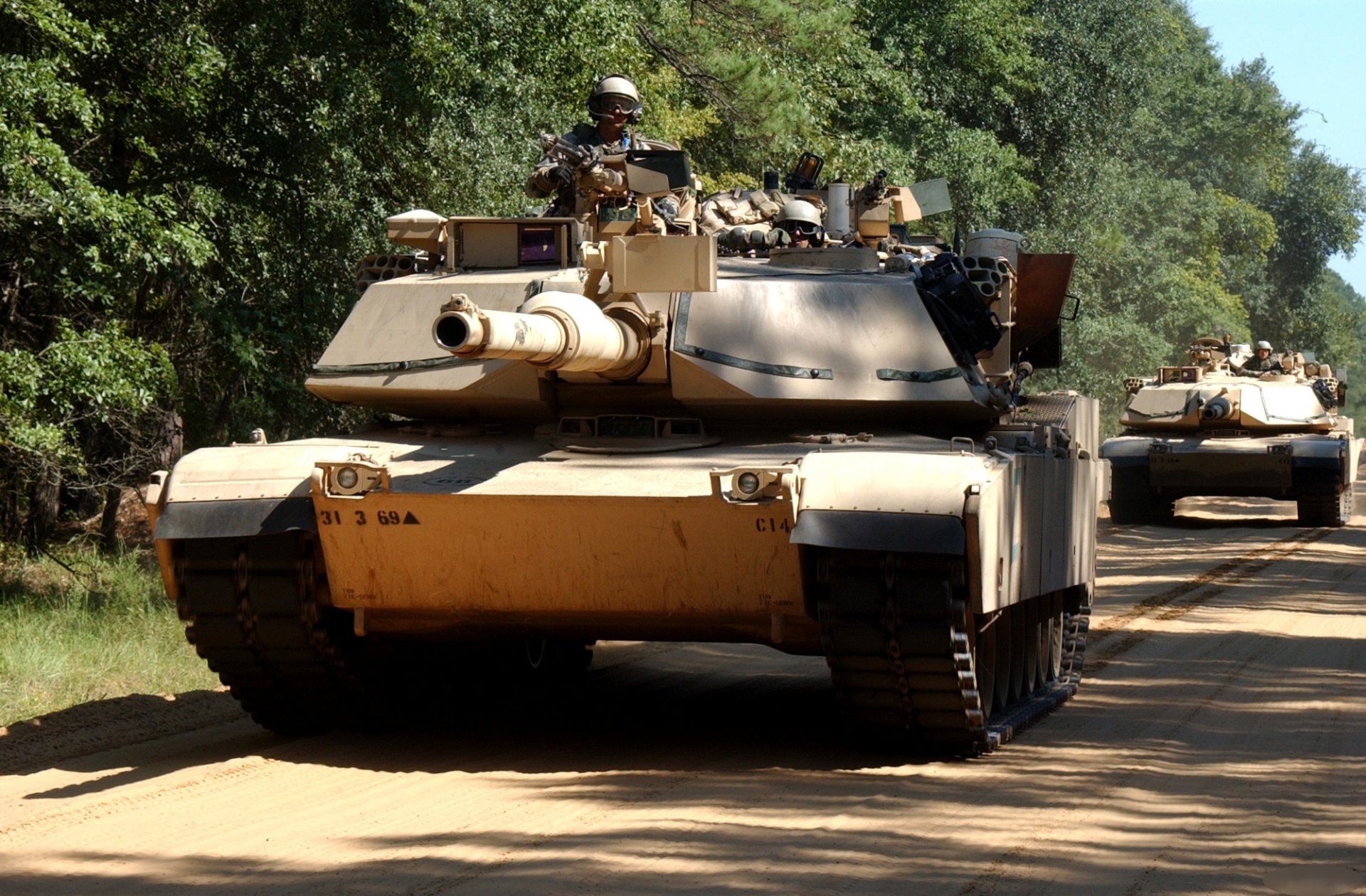 column of tanks tanks road troops the army united states abram