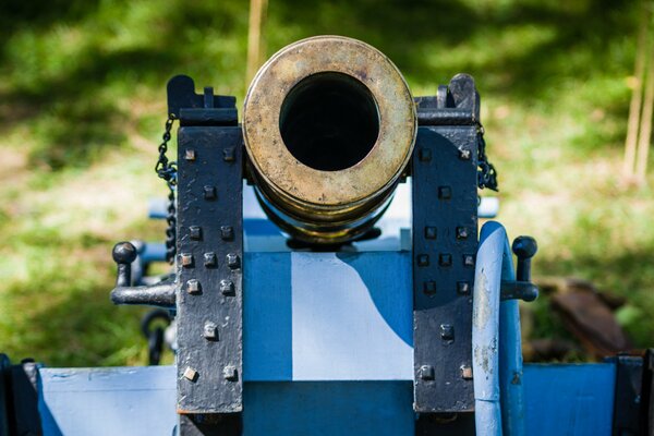 An artillery piece. The muzzle of a modern cannon