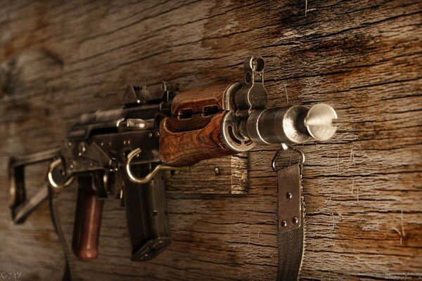 Kalashnikov assault rifle hanging on the wall