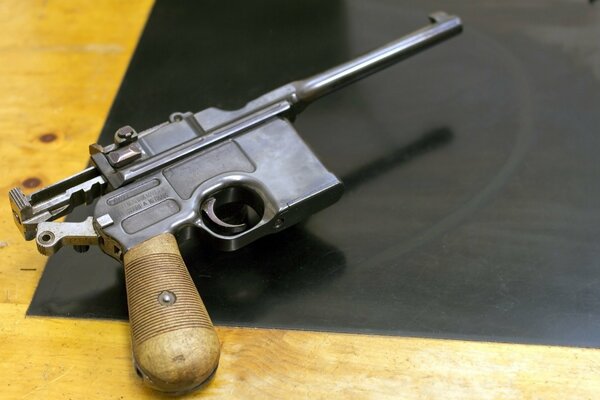 A small c96 pistol on the table