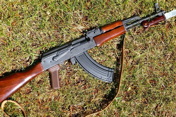 Kalashnikov assault rifle on the grass