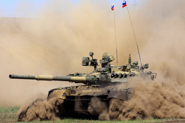 Russian T-80u battle tank raising columns of dust