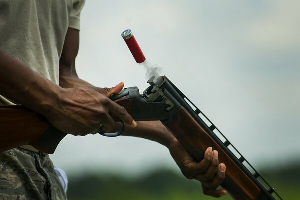 The cartridge case flies out of the gun during reloading