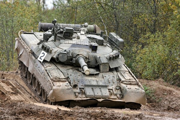 Russian tank at the landfill in the mud