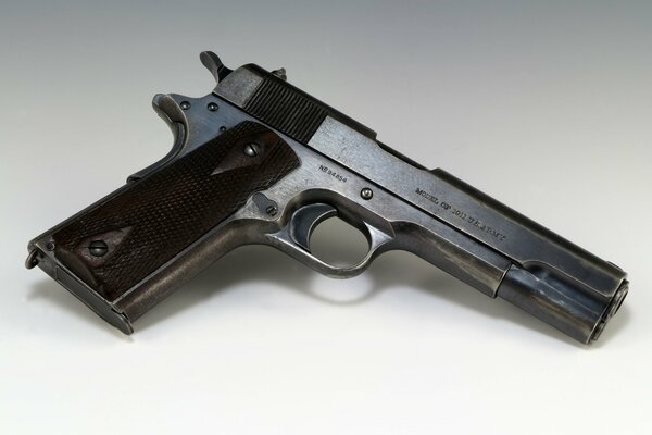 Photo of the M 1911 pistol with a brown handle