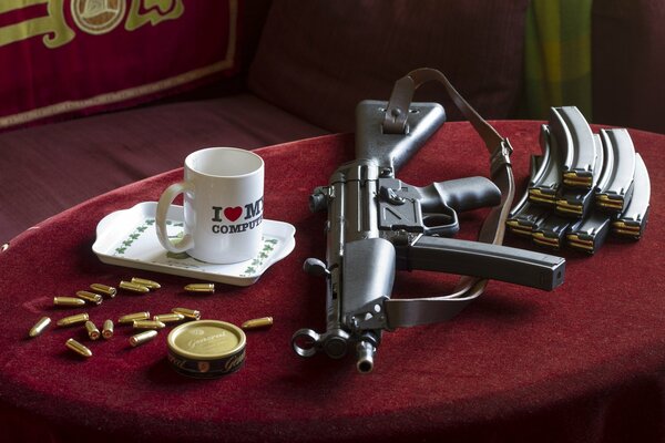 Burgundy table with a cup and a weapon