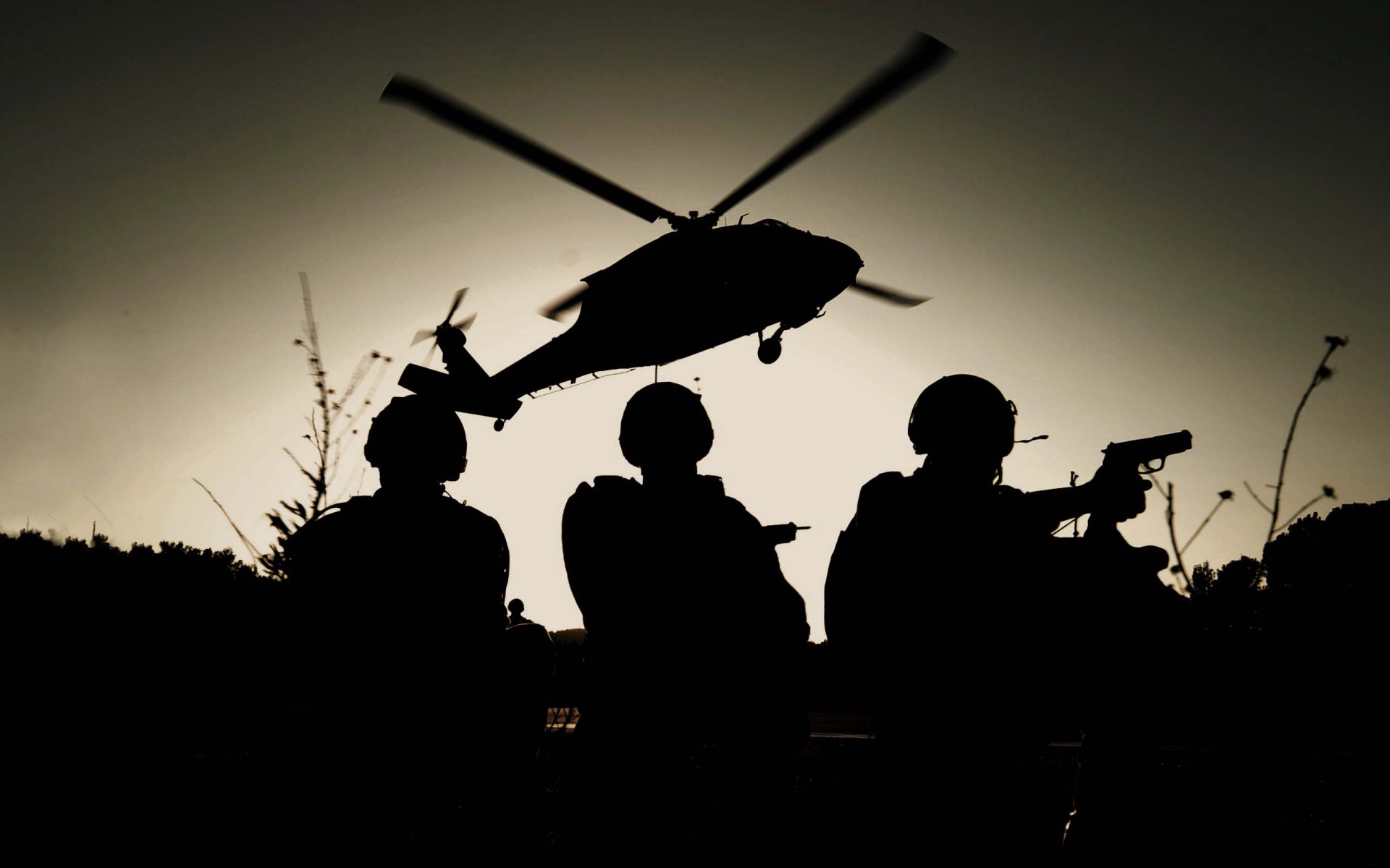 men special forces landing helicopters mh-60k black hawk silhouettes to night