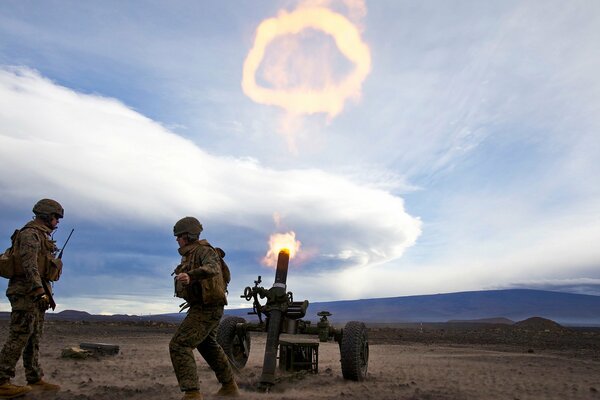 Soldiers shoot a cannon into the sky