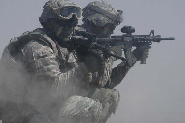 Armed soldiers Marines in the dust