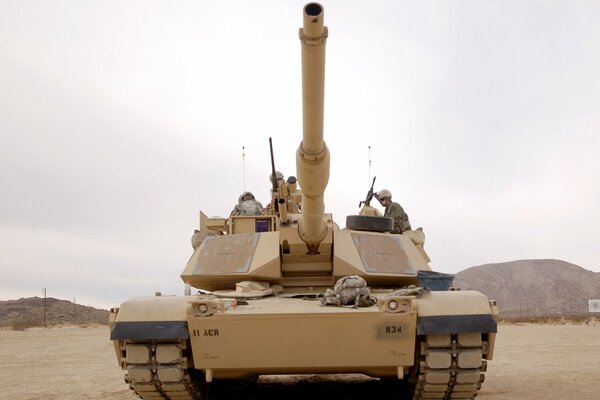 Image of a tank against a background of weapons