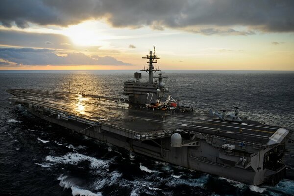 A huge aircraft carrier in the ocean is ready for anything