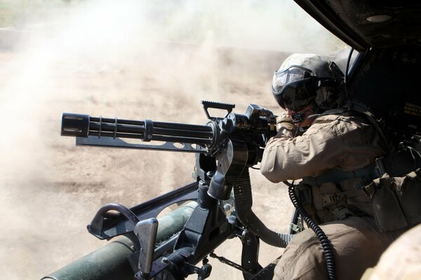 The machine gunner takes aim from the shelter