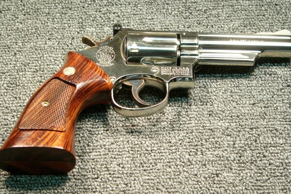 Revolver with a wooden handle close-up