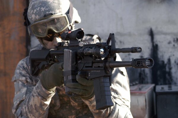 A US soldier shoots a rifle