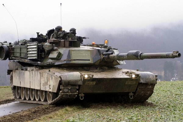 Tank in combat readiness with soldiers