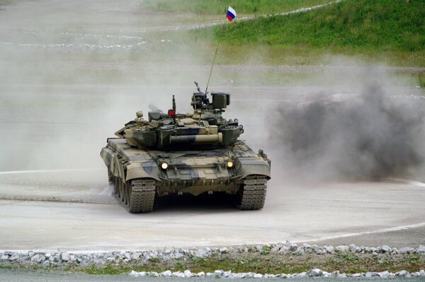 T-90 tank in smoke with a Russian flag