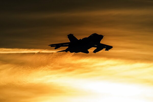 Beautiful view of the plane at sunset sky