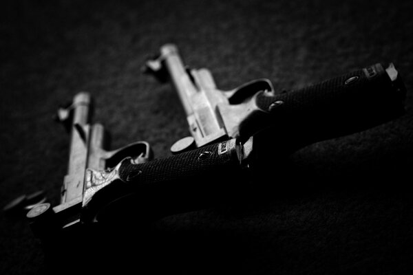 Black and white photo with two pistols